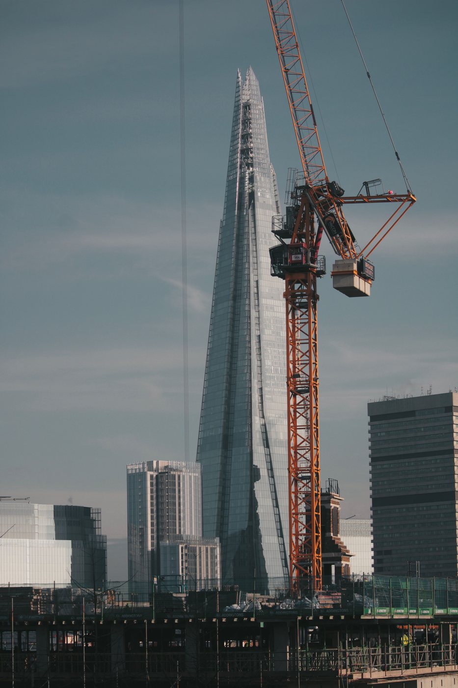 Construction crane beside The Shard in London