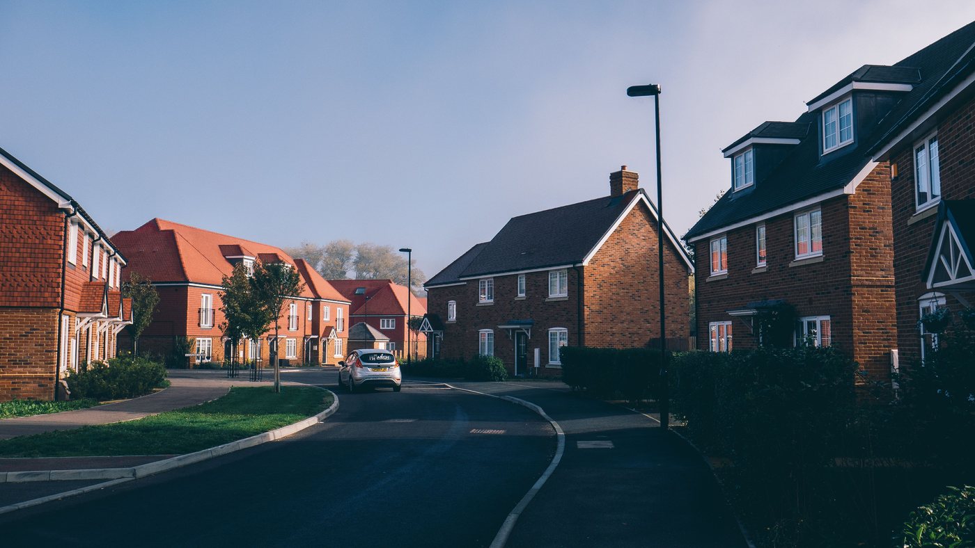Red-brick houses on an English suburban street