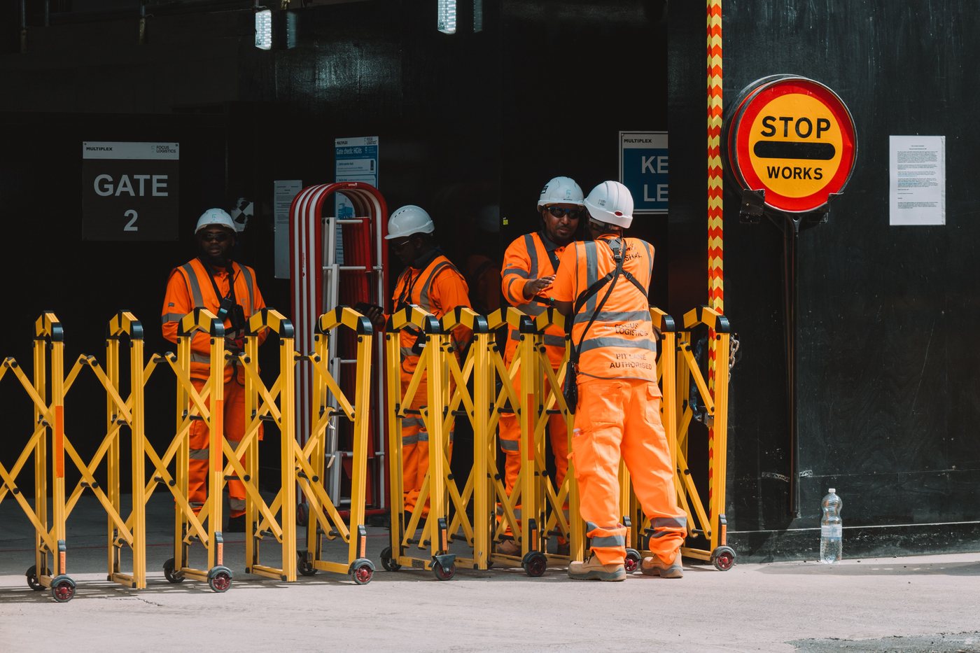 Construction workers in safety gear at a London site